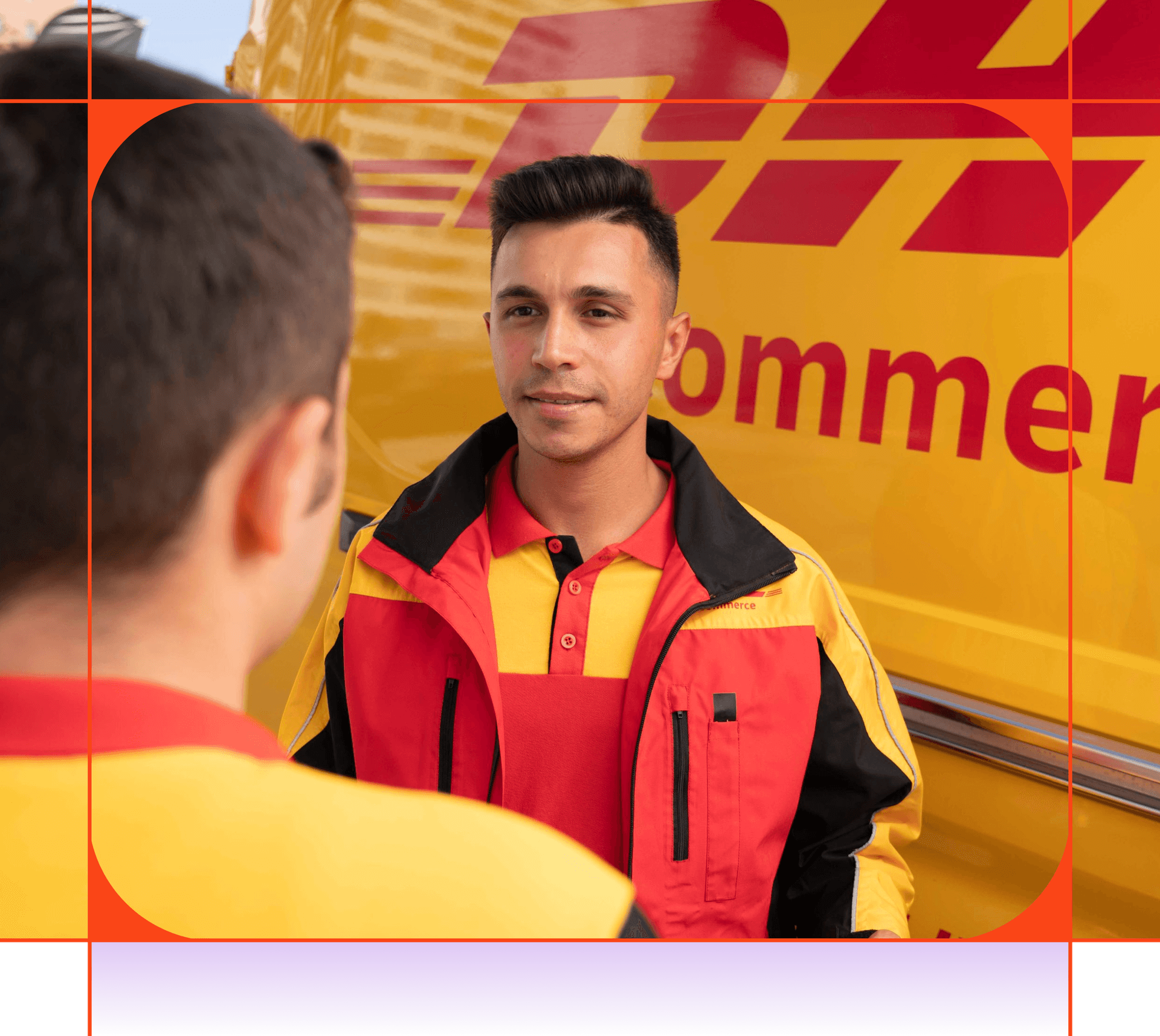 Two DHL employees in uniform, one smiling, in front of a DHL van.