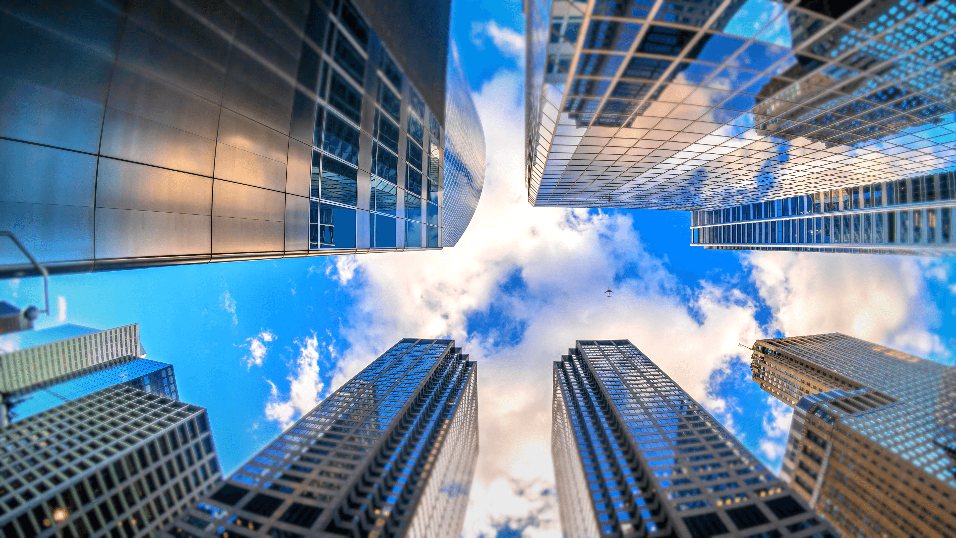 Image of buildings and the sky above them.