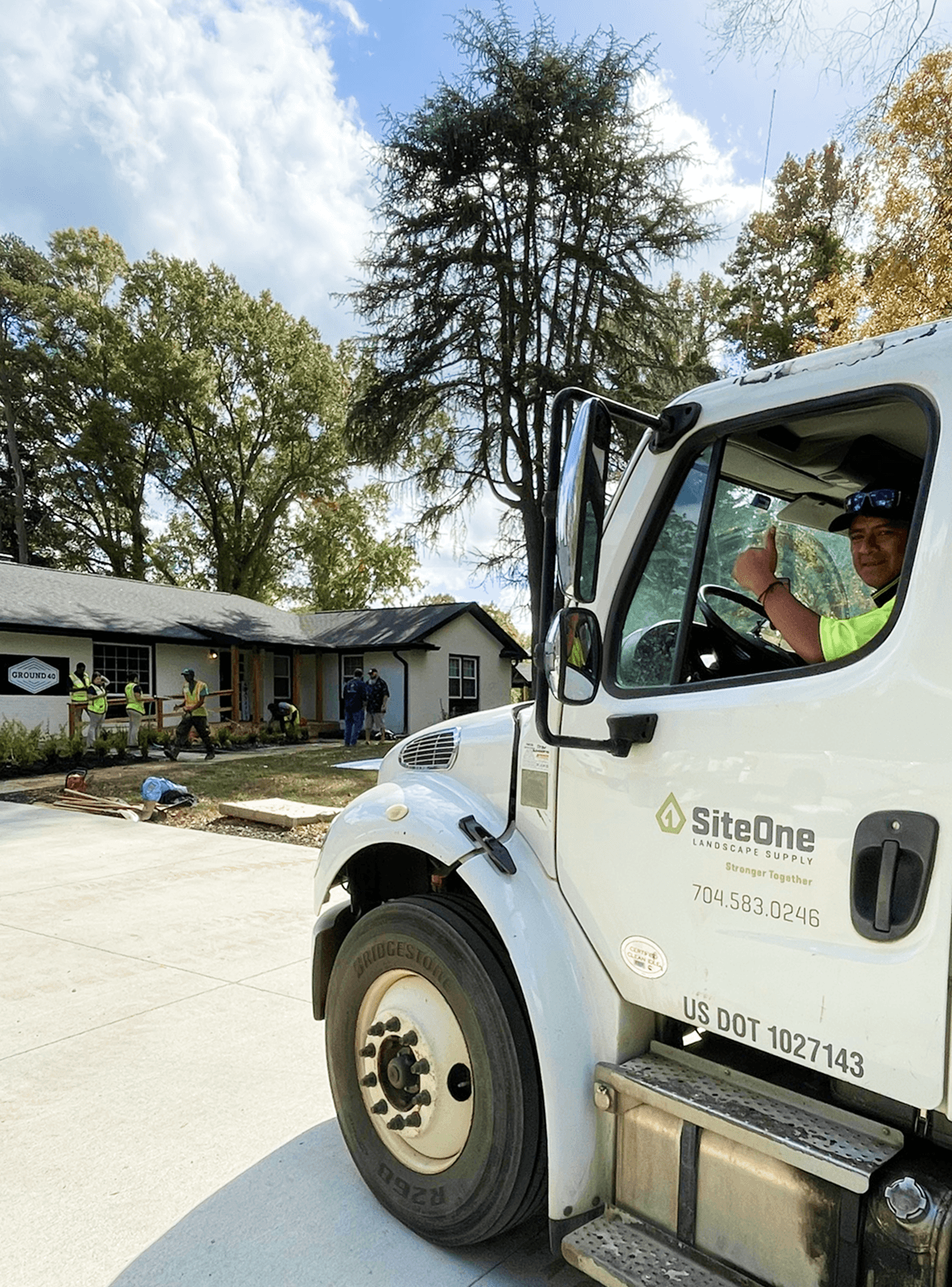 Image of a SiteOne truck in customer driveway.
